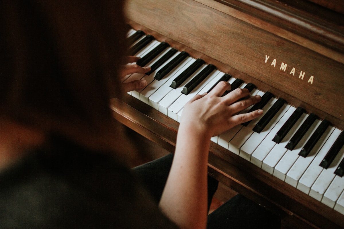 Piano keys in warm candlelight — classic and instrumental songs are among the most popular choices for funeral slideshow music
