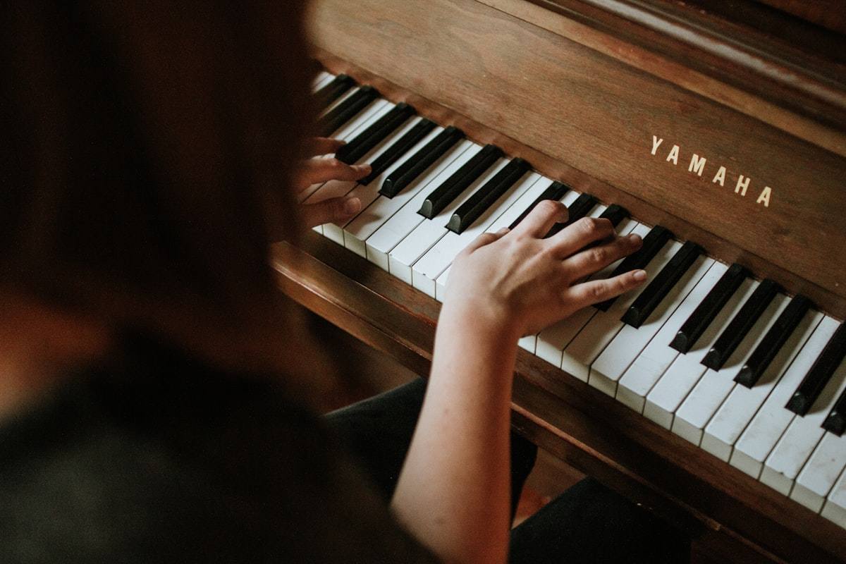 Piano keys in warm candlelight, classic and instrumental songs are among the most popular choices for funeral slideshow music