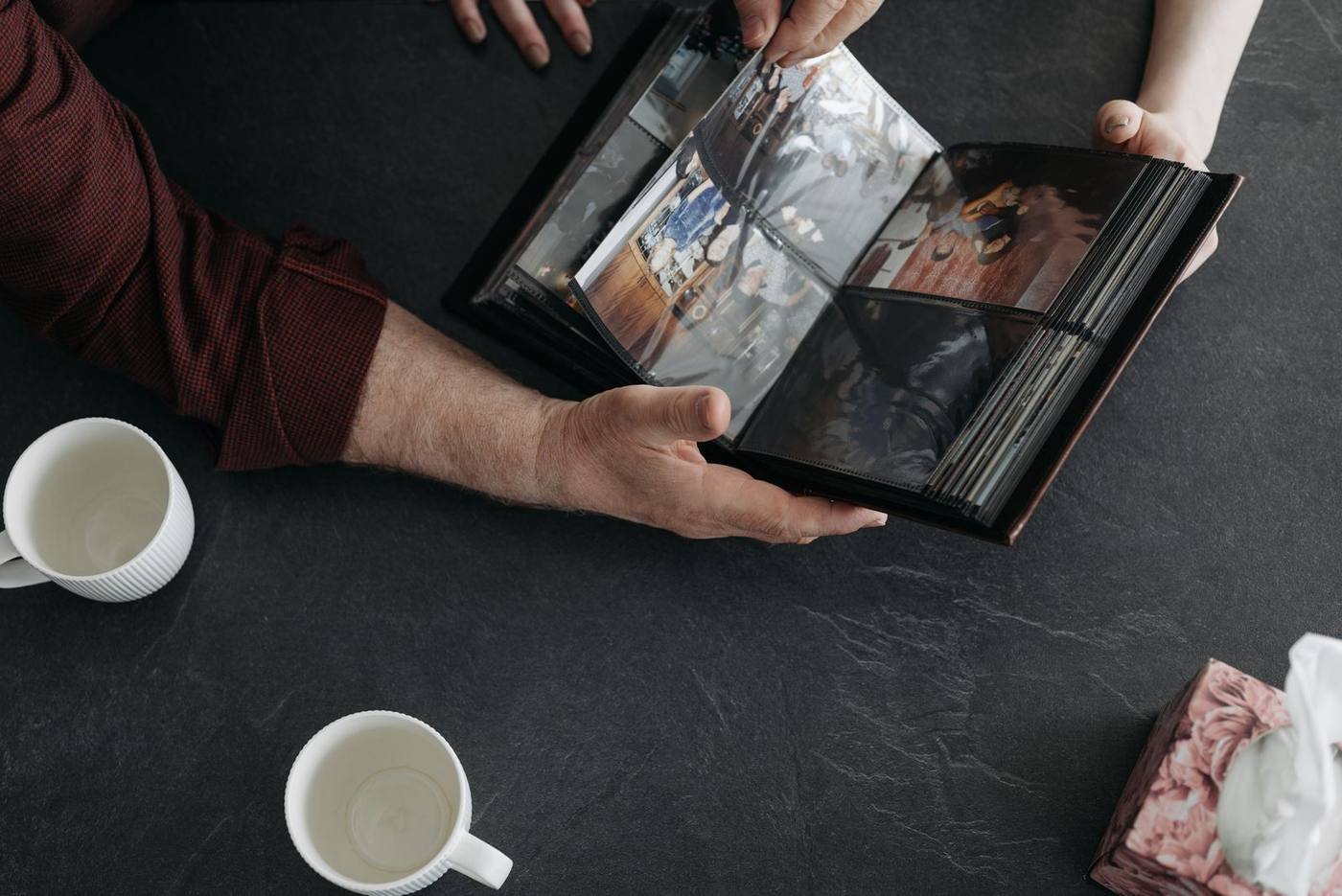 A memorial photo book or a tribute video: choosing between them